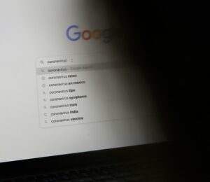 black laptop computer turned on displaying google search